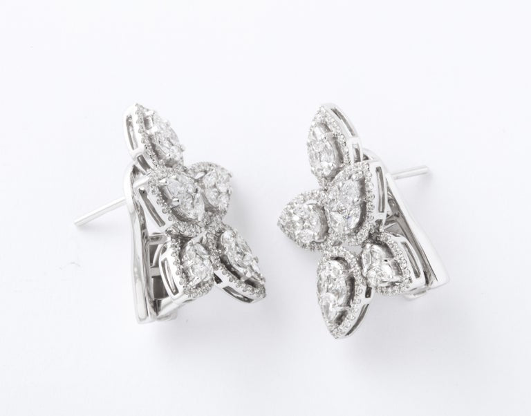 https://a.1stdibscdn.com/diamond-cluster-earrings-for-sale-picture-7/j_415/j_140275121637953079624/6R1A1274_master.jpg?width=768