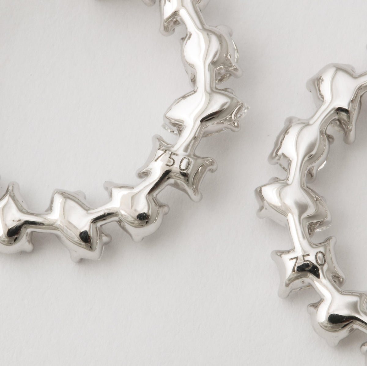 https://a.1stdibscdn.com/multi-shape-diamond-swirl-hoop-earrings-for-sale/1121189/j_122720421620818337167/12272042_master.jpg