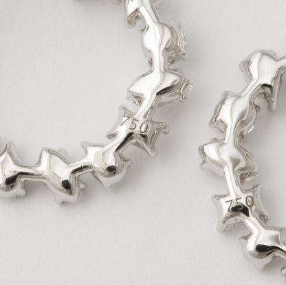 https://a.1stdibscdn.com/multi-shape-diamond-swirl-hoop-earrings-for-sale/1121189/j_122720421620818337167/12272042_master.jpg