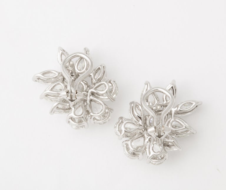 https://a.1stdibscdn.com/diamond-cluster-earrings-for-sale-picture-9/j_415/j_172984621666015948397/6R1A1312_master.jpg?width=768