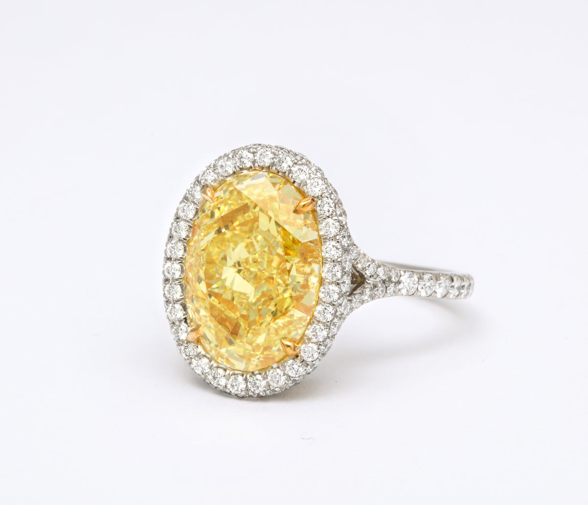 GIA Certified 5.05 Carat Oval Fancy Yellow Diamond Platinum Ring