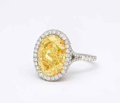 GIA Certified 5.05 Carat Oval Fancy Yellow Diamond Platinum Ring