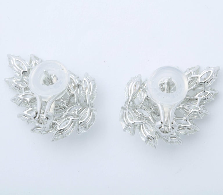 https://a.1stdibscdn.com/diamond-cluster-earrings-for-sale-picture-3/archivesE/upload/0/j_41520831523637144506/6R1A2644_master.jpg?width=768