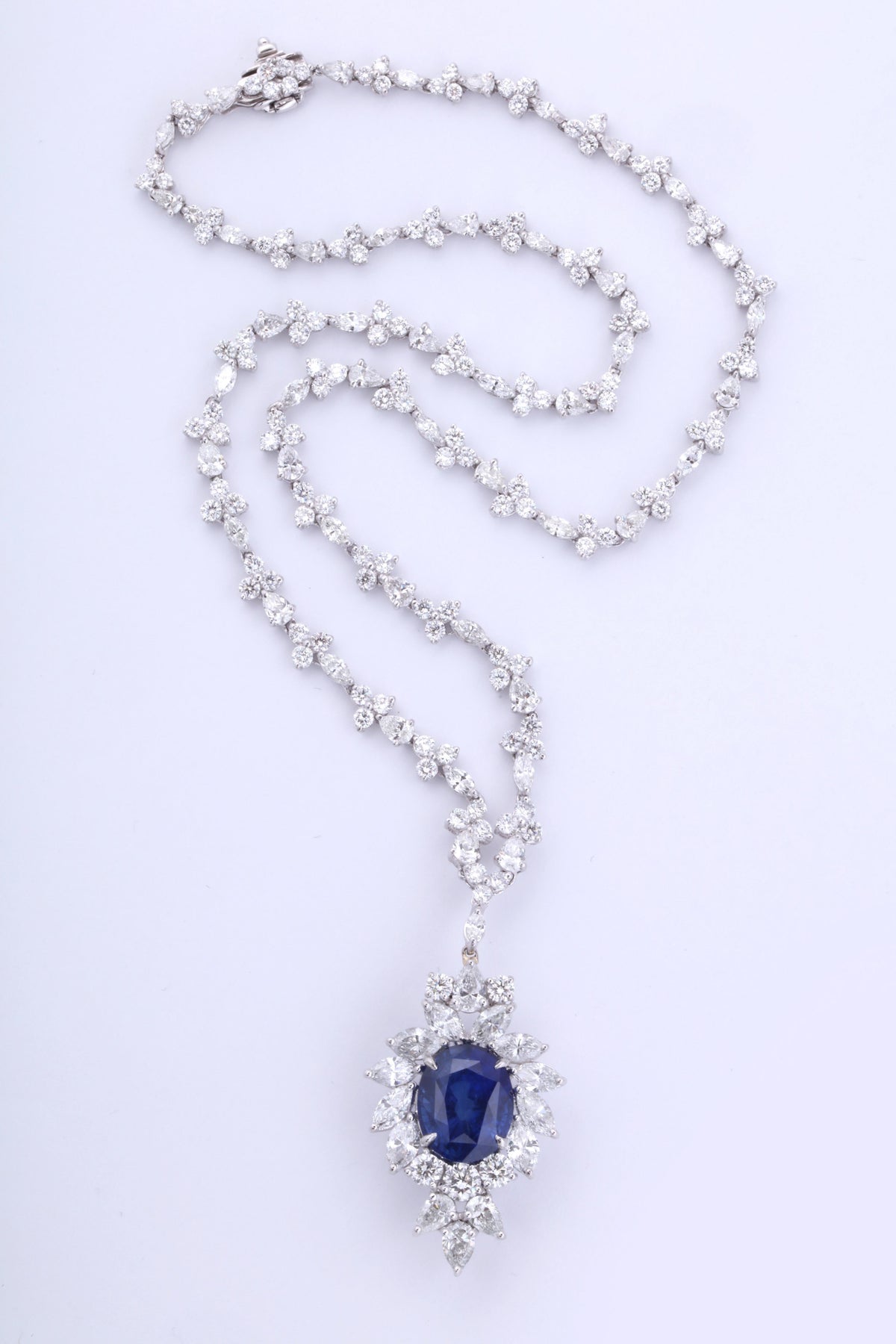 https://a.1stdibscdn.com/vivid-blue-ceylon-sapphire-and-diamond-pendant-necklace-for-sale-picture-3/0/j_56032021544653090604/6R1A3347_master.jpg