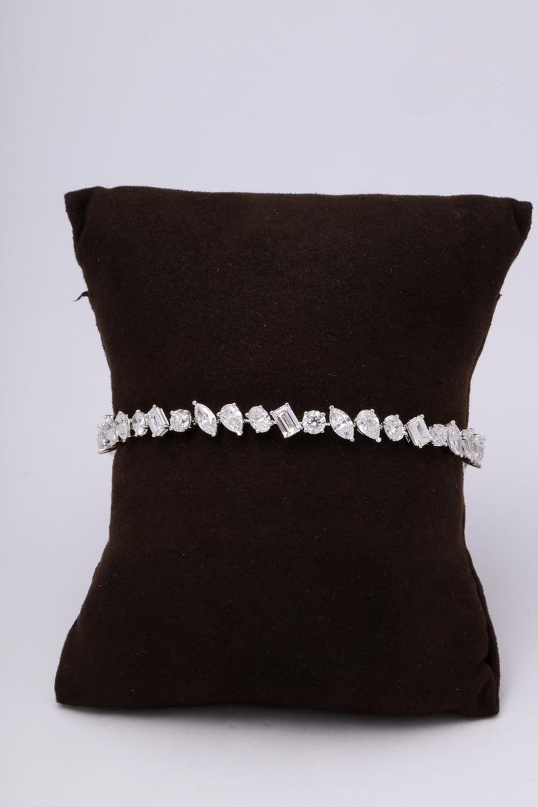 https://a.1stdibscdn.com/multi-shape-diamond-tennis-bracelet-for-sale-picture-5/366869/j_57882221553111221029/6R1A3403_org_master.jpg