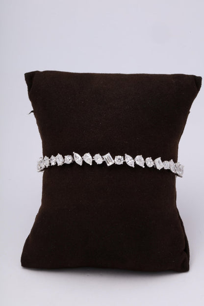 https://a.1stdibscdn.com/multi-shape-diamond-tennis-bracelet-for-sale-picture-5/366869/j_57882221553111221029/6R1A3403_org_master.jpg