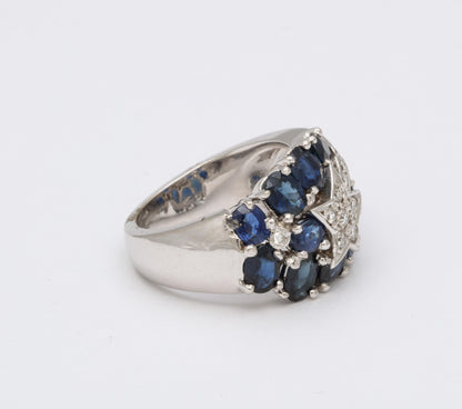 https://a.1stdibscdn.com/sapphire-and-diamond-shooting-star-cocktail-ring-for-sale-picture-5/j_415/1618934647021/6R1A4925_master.jpg