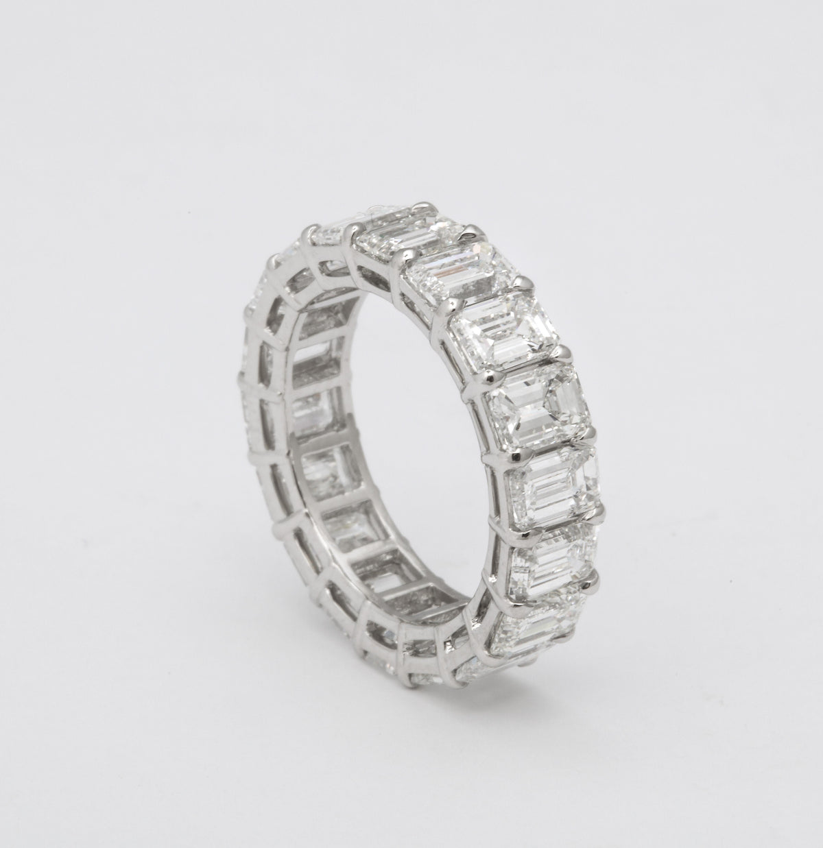 Exquisite 7.82 Carat Emerald Cut Diamond Platinum Eternity Band Ring