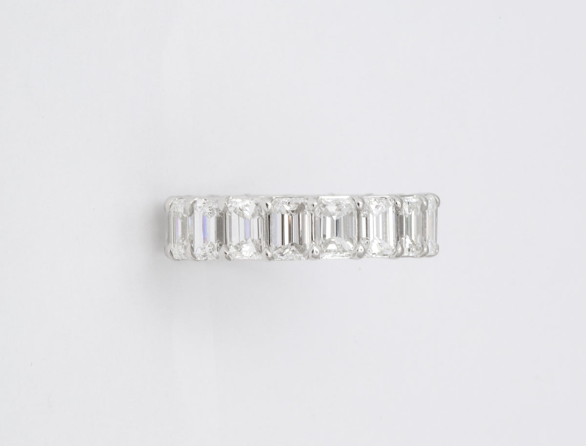 Exquisite 7.82 Carat Emerald Cut Diamond Platinum Eternity Band Ring