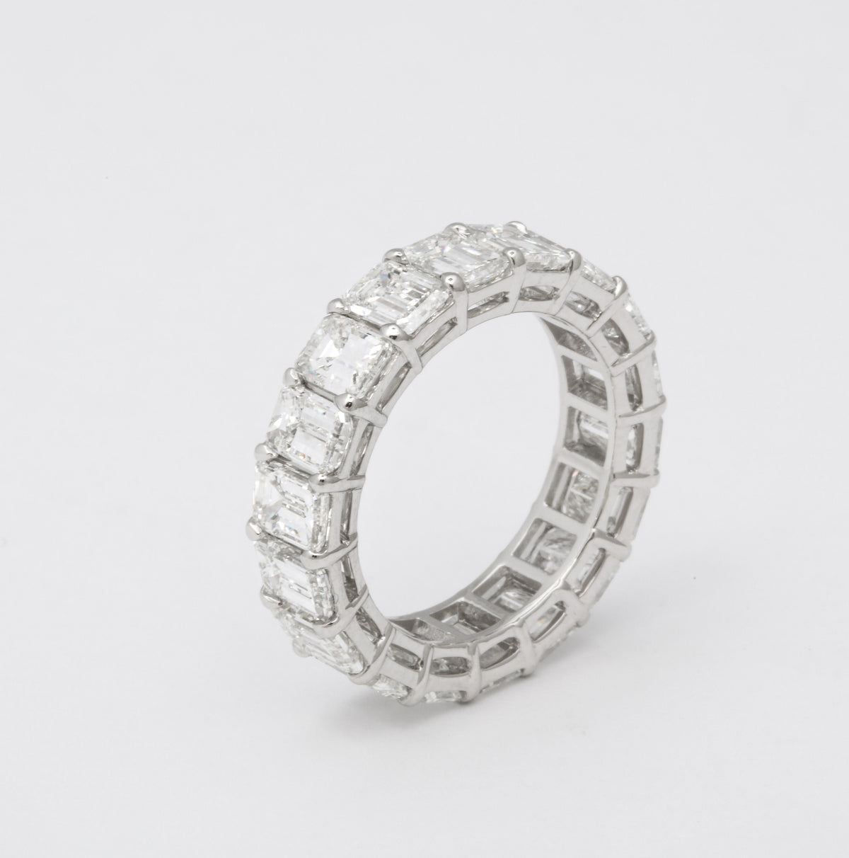 Exquisite 7.82 Carat Emerald Cut Diamond Platinum Eternity Band Ring
