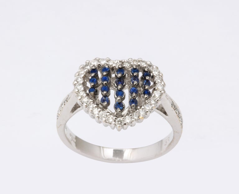 https://a.1stdibscdn.com/blue-sapphire-and-diamond-heart-ring-for-sale-picture-4/j_415/j_130857321629391603959/6R1A5021_master.jpg?width=768