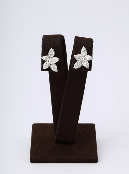 https://a.1stdibscdn.com/cluster-diamond-earrings-for-sale-picture-3/j_415/j_167933421661437836789/6R1A5076_master.jpg?width=768