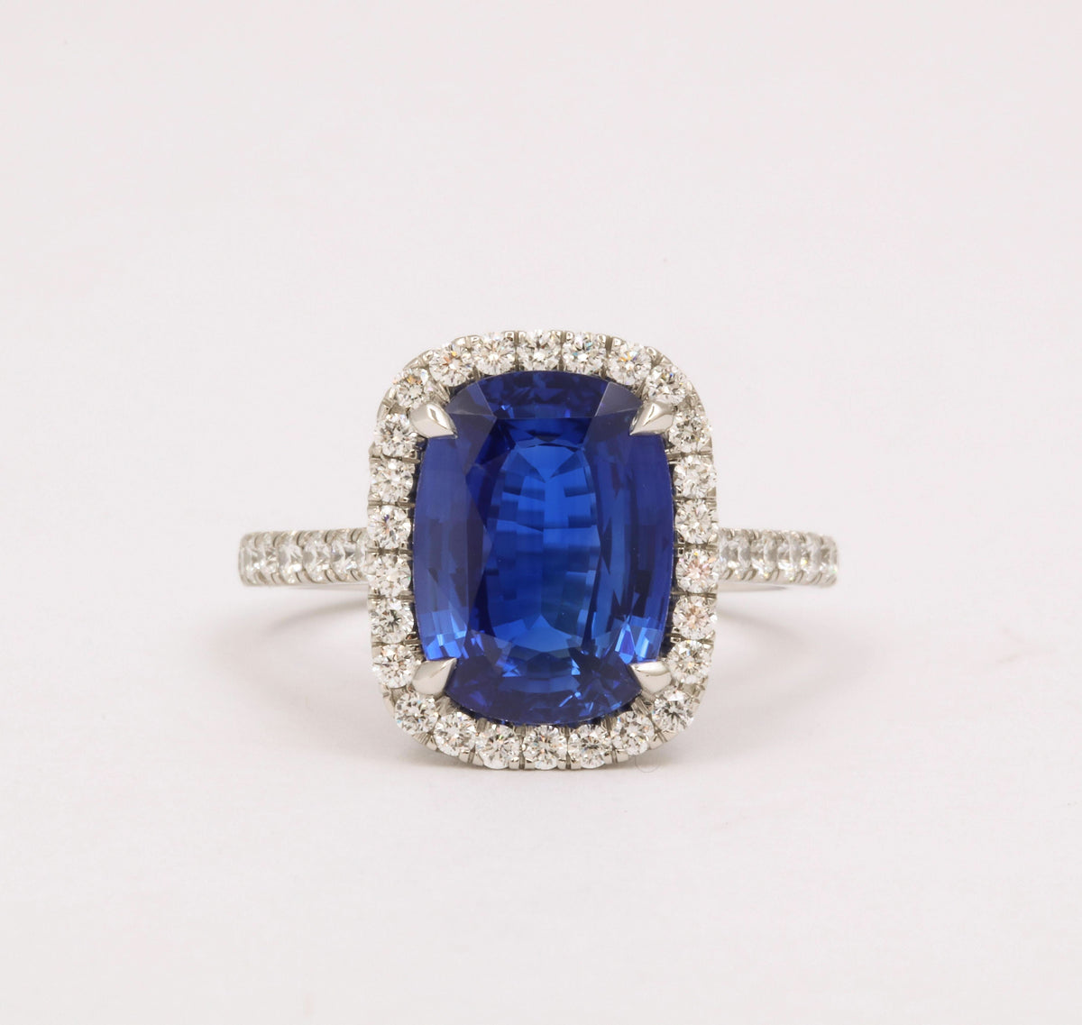 https://a.1stdibscdn.com/cushion-cut-blue-sapphire-and-diamond-halo-ring-for-sale-picture-4/j_415/j_194450021685541114442/6R1A5484_master.jpg