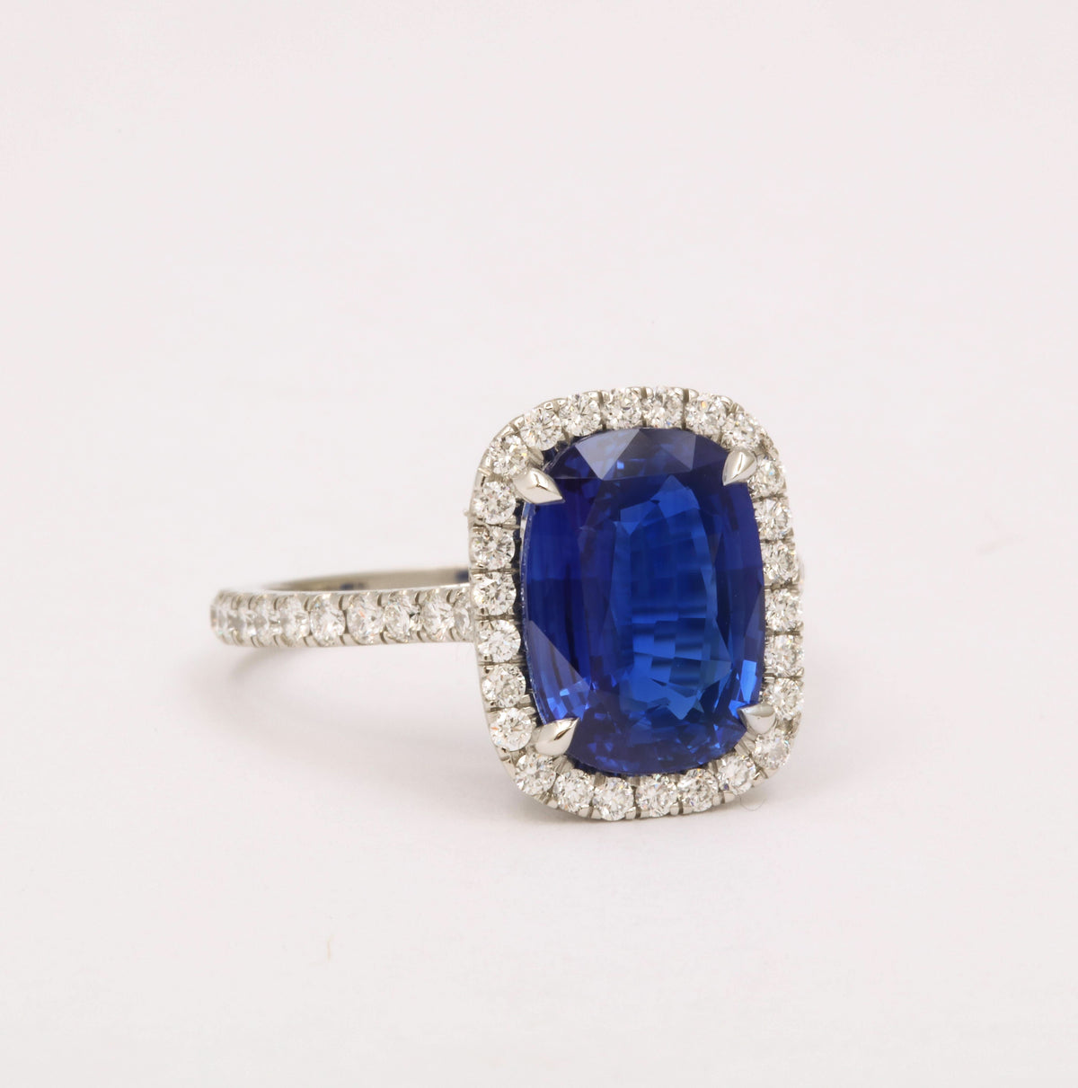 https://a.1stdibscdn.com/cushion-cut-blue-sapphire-and-diamond-halo-ring-for-sale-picture-6/j_415/j_194450021685541114340/6R1A5486_master.jpg