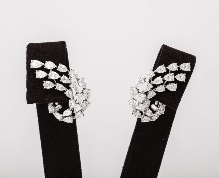 https://a.1stdibscdn.com/diamond-swirl-earrings-for-sale-picture-3/j_415/j_155244021650563395611/6R1A6730_master.jpg?width=768
