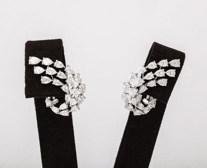 https://a.1stdibscdn.com/diamond-swirl-earrings-for-sale-picture-3/j_415/j_155244021650563395611/6R1A6730_master.jpg?width=768