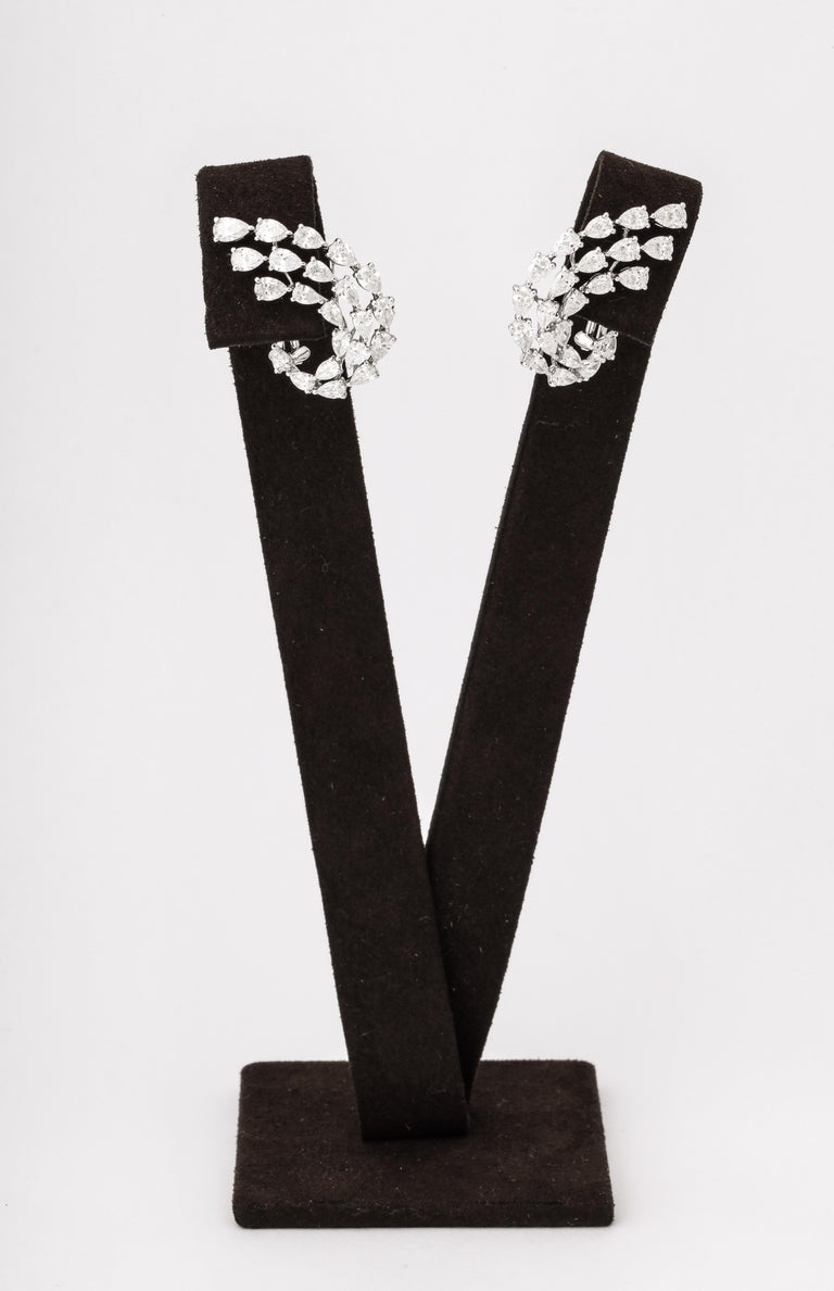https://a.1stdibscdn.com/diamond-swirl-earrings-for-sale-picture-6/j_415/j_155244021650563395445/6R1A6734_master.jpg?width=768