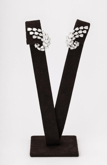 https://a.1stdibscdn.com/diamond-swirl-earrings-for-sale-picture-6/j_415/j_155244021650563395445/6R1A6734_master.jpg?width=768
