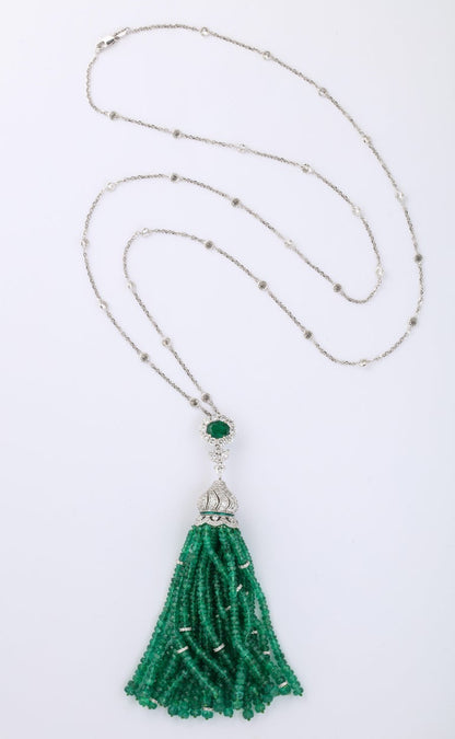 https://a.1stdibscdn.com/emerald-and-diamond-tassel-necklace-for-sale-picture-3/j_415/1605728001304/6R1A7452_master.jpg?width=768
