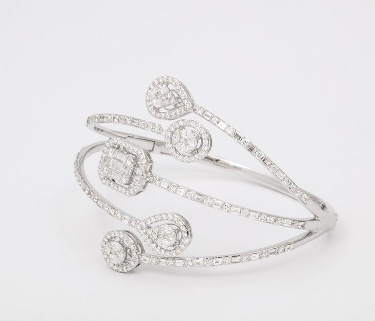 https://a.1stdibscdn.com/multi-shape-diamond-bangle-bracelet-for-sale-picture-3/j_415/j_143753121641493897497/6R1A8493_master.jpg?width=768