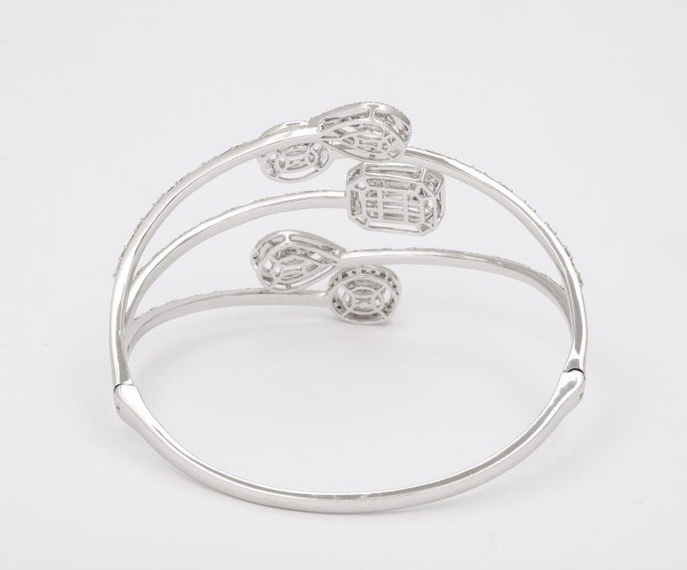 https://a.1stdibscdn.com/multi-shape-diamond-bangle-bracelet-for-sale-picture-7/j_415/j_143753121641493902104/6R1A8497_master.jpg?width=768
