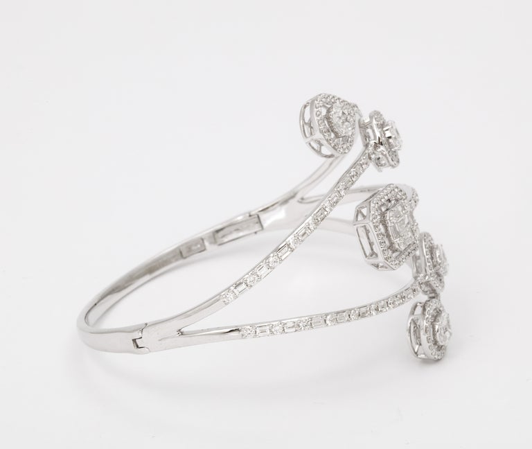 https://a.1stdibscdn.com/multi-shape-diamond-bangle-bracelet-for-sale-picture-9/j_415/j_143753121641493902179/6R1A8499_master.jpg?width=768