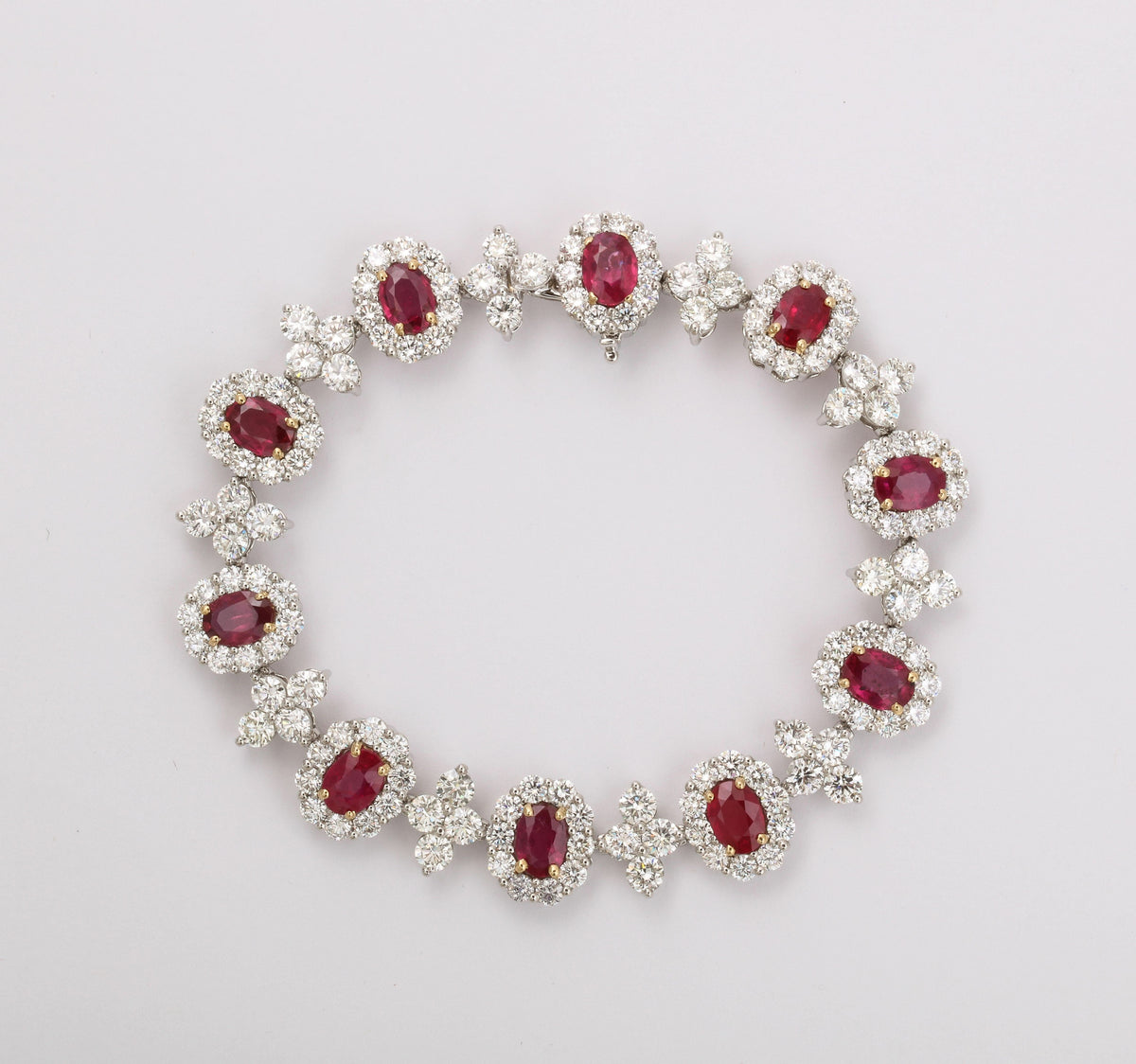 Elegant 9.20ct Oval Ruby and 14.56ct Diamond Platinum Link Bracelet