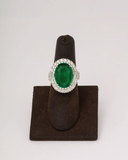 https://a.1stdibscdn.com/9-carat-vivid-green-emerald-and-diamond-ring-for-sale-picture-7/j_415/j_202926821694024997820/6R1A8724_master.jpg?width=768