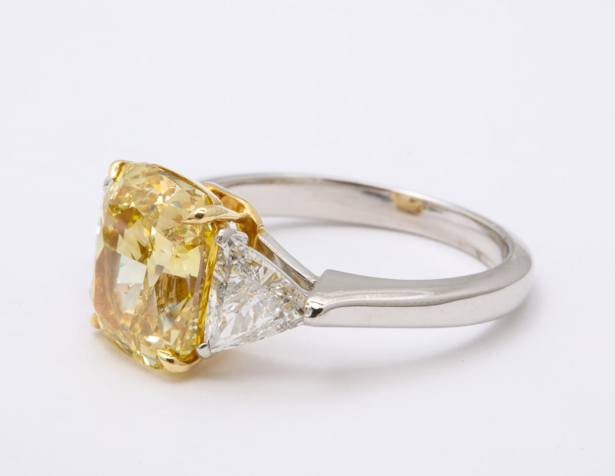 https://a.1stdibscdn.com/gia-certified-4-carat-fancy-intense-yellow-diamond-ring-for-sale-picture-5/j_415/1598973568687/6R1A9303_master.jpg