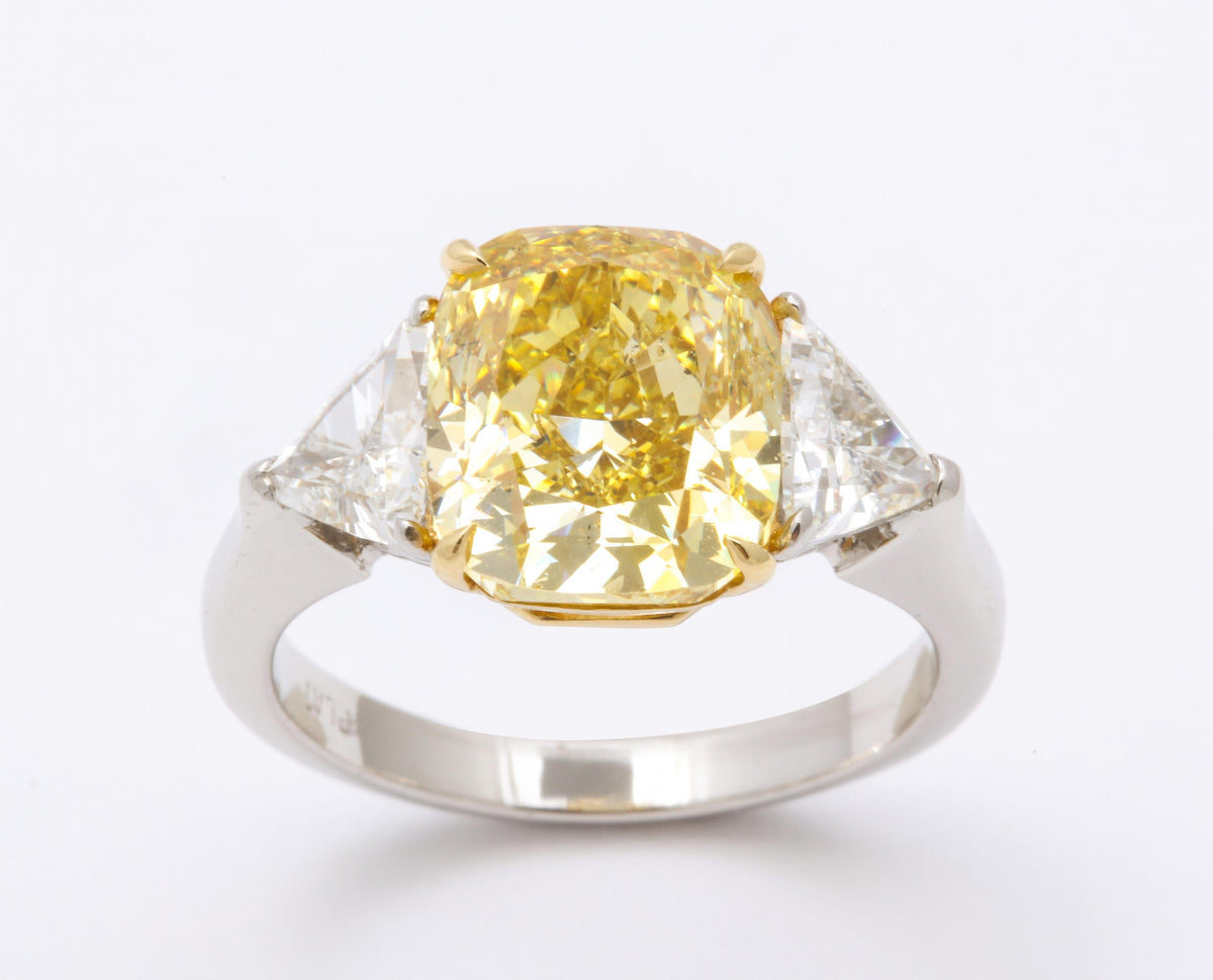 GIA Certified 4 Carat Fancy Intense Yellow Diamond Platinum Ring