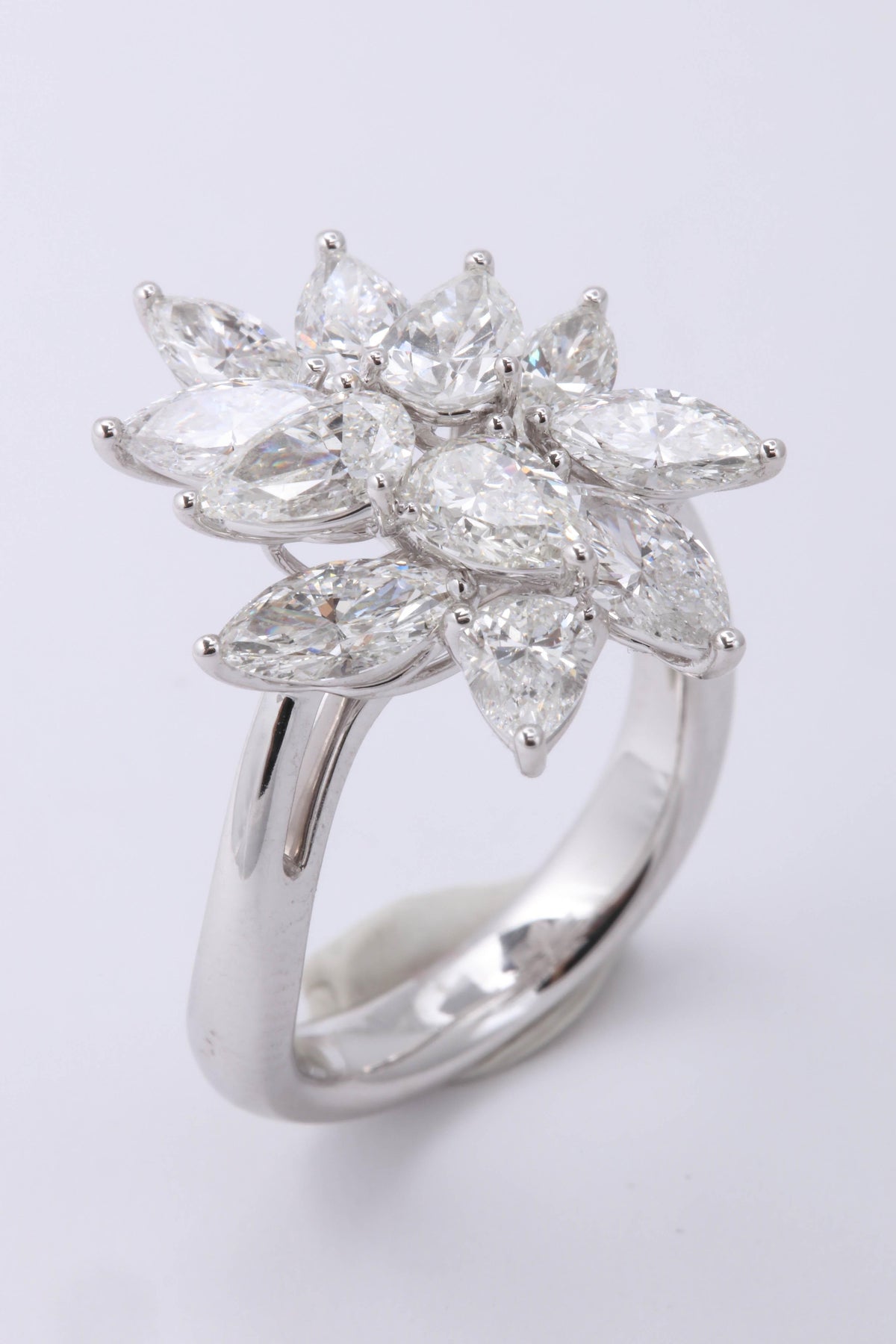 https://a.1stdibscdn.com/diamond-cluster-ring-for-sale-picture-3/0/j_50847211539355650252/6R1A9562_master.jpg