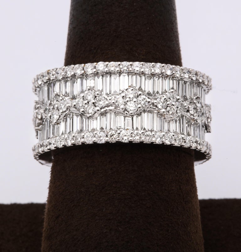 https://a.1stdibscdn.com/wide-baguette-and-round-diamond-band-for-sale-picture-2/j_415/1606754919296/6R1A9886_master.jpg?width=768
