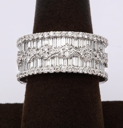 https://a.1stdibscdn.com/wide-baguette-and-round-diamond-band-for-sale-picture-2/j_415/1606754919296/6R1A9886_master.jpg?width=768