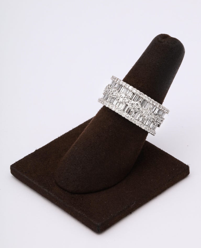 https://a.1stdibscdn.com/wide-baguette-and-round-diamond-band-for-sale-picture-6/j_415/1606754935736/6R1A9893_master.jpg?width=768