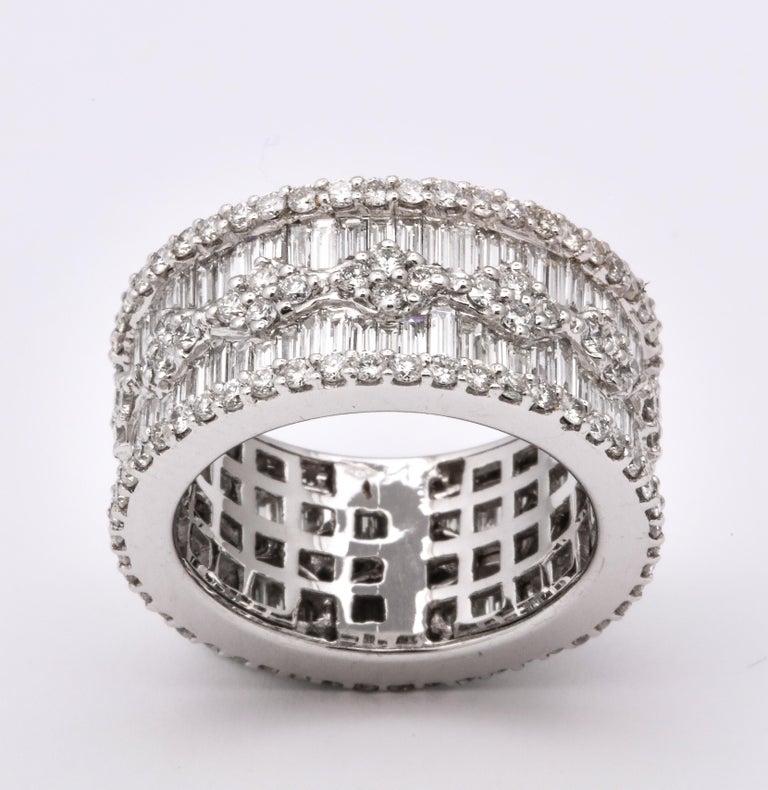https://a.1stdibscdn.com/wide-baguette-and-round-diamond-band-for-sale-picture-8/j_415/1606754944782/6R1A9895_master.jpg?width=768