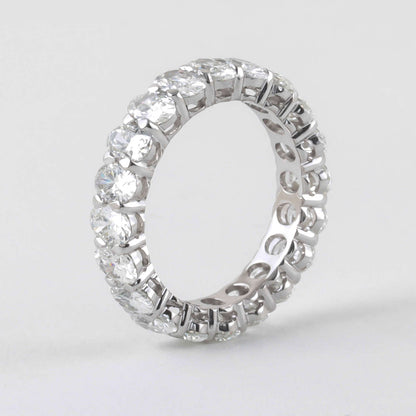 Exquisite 4.86 Carat Oval Diamond 18k White Gold Eternity Band