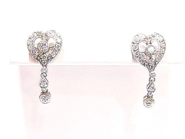 ROUND BRILLIANT CUT BEZEL AND PRONG SET DIAMOND ANTIQUE