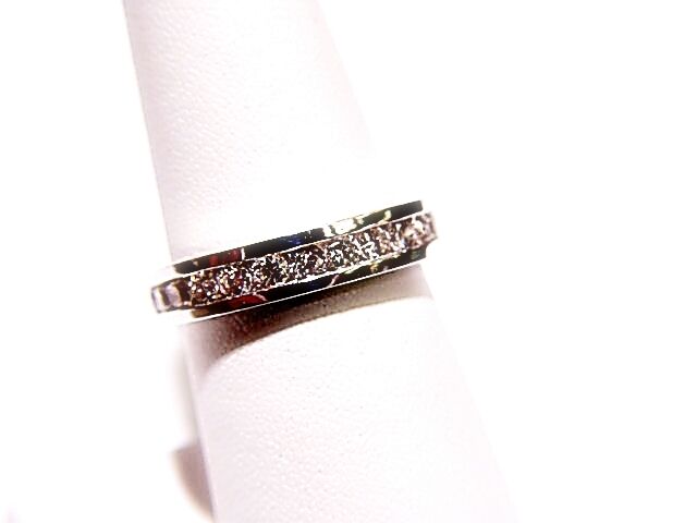DIAMOND CHANNEL SET ALL THE WAY AROUND THE BAND ETERNITY