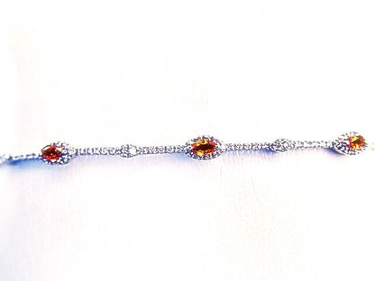 6 MARQUISE CUT YELLOW SAPPHIRES SET WITH ROUND BRILLIANT