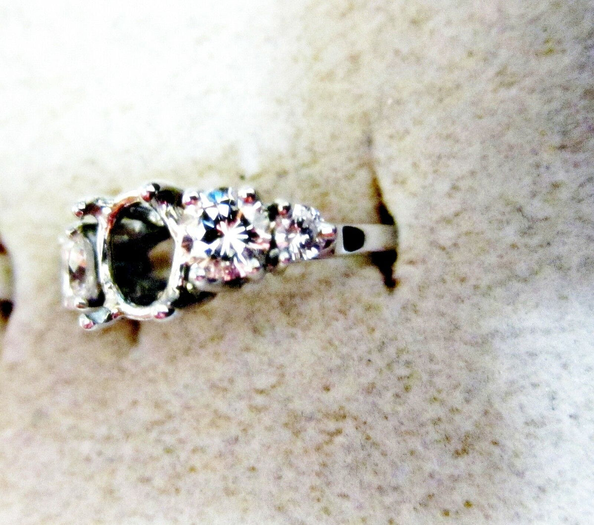 Diamond setting and two and two round brilliant shape diamond engagement setting