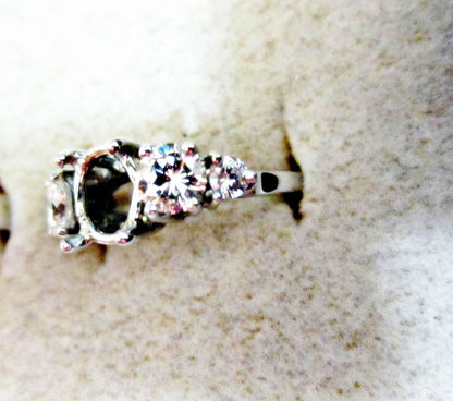 Diamond setting and two and two round brilliant shape diamond engagement setting