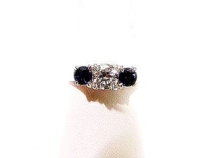 .80 CT 2 SAPPHIRE SHAPE SIDE STONE 1 ROUND BRILLIANT SH .61 CT DIAMOND 18 K GOLD