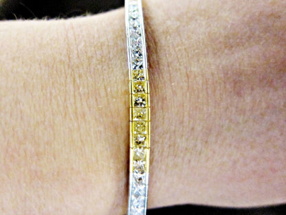 Fancy yellow 6.60 CT diamond 32 piece princess white diamond 18 K