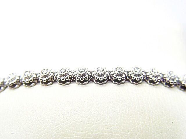 DIAMOND ROUND BRILLIANT SHAPE 31 STONE SET BEZEL SET DIAMOND