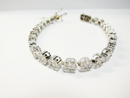 DIAMOND ROUND BRILLIANT CLUSTER SEVEN STONE SET EACH CLUSTER TENNIS BRACELET
