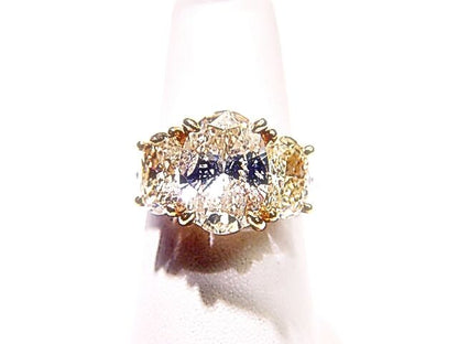 LABORATORY CERTIFIED FANCY LIGHT YELL PLAT GOLD D61.5% T60% GIRDLEMED TO THICK