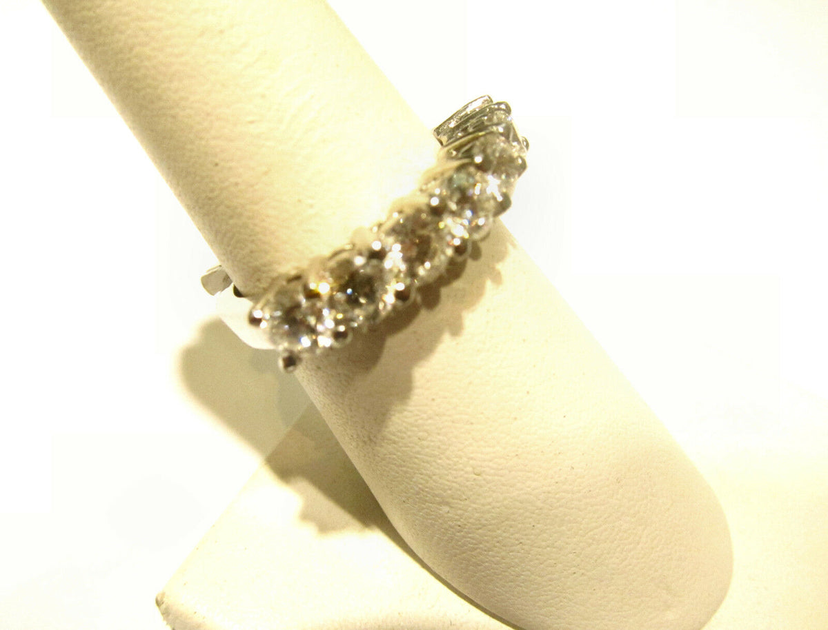 DIAMOND SEVEN ROUND BRILLIANT COMMON PRONG SET DIAMOND BAND