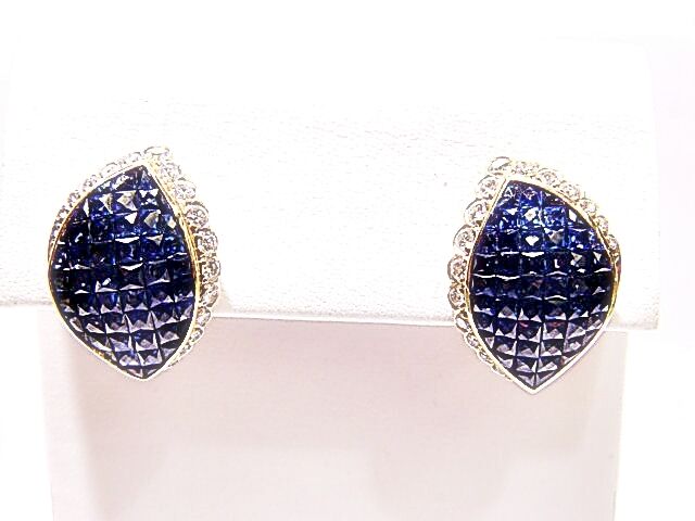 FRENCH CUT BLUE SAPPHIRES INVISIBLE SET WITH ROUND BRILLIANT DIAMOND