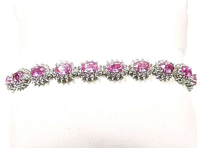 17 OVAL PINK SAPPHIRES SET WITH ROUND BRILLIANT CUT DIAMONDS