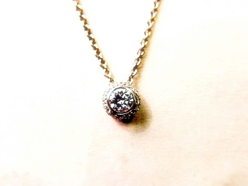 ROUND BRILLIANT CUT DIAMOND PENDANT .41 CT CENTER .33 CT